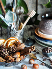 Winter ingredients in a bowl, empty cookware. Rustic style