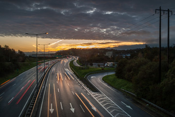 Fototapeta na wymiar Morning sunrise on rush hour traffic, N40 motorway in Cork city, Ireland