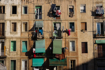 Slum apartments with blinds in Raval, Barcelona, Spain.
