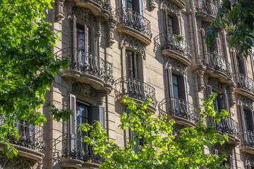 Apartments with wrought iron balconies in Eixample, Barcelona, Spain, illustrating property, luxury...
