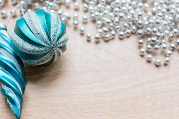 Christmas New Year holiday background. Silver garland and xmas tree decoration toys