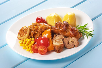 Meat pork kebab with potatoes and onion