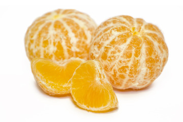Mandarins (tangerine) isolated on white background.Whole and slices of  citrus fruits.The symbol of Christmas holydays.