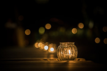 candle light in glass small jar