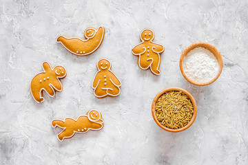 Make gluten free healthy food. Yoga asanas cookies near desk, flour and wheat on stone background...