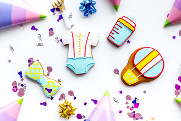 treat for baby birthday party with gingerbread cookies on white background top view pattern