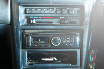 the display of console of the old car,the equipment , accessory and many button on panel