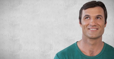 Man looking up with white stone background