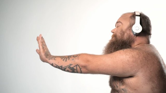 Bearded guy moving hands in rhythm of melody