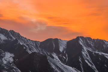 Fototapeta na wymiar orange sunset over the mountain peaks
