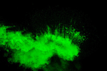 green color powder splash cloud isolated on black background
