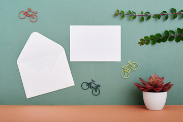 Greeting card mockup on green wall background