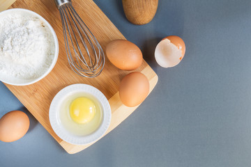 Eggs, flour, rolling pin, shape, corolla, baking ingredients with a copy of a stretch in a vintage style