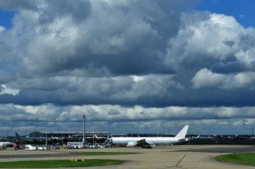 Fototapeta na wymiar Airplane at the airport runway