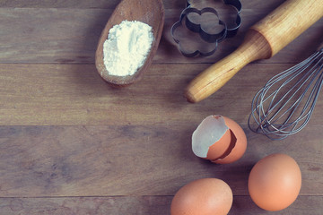 Eggs, flour, rolling pin, shape, corolla, baking ingredients with a copy of a stretch in a vintage style