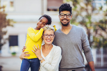 Happy young mixed race couple spending time with their daughter