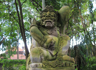 Fototapeta na wymiar Traditional demon stone carved statue in Ubud, Bali island, Indonesia.