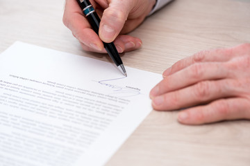 Man signing a contract