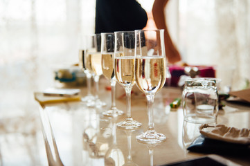 Champagne glasses and bottle, close-up.