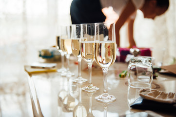 Champagne glasses and bottle, close-up.