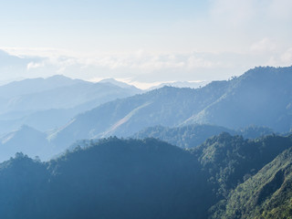 The pattern of green slope and peaks of mountain ridges with the late morning's soft light. This great peaceful place uses 1 day for trekking at Doi Phu Wae, Nan province, Thailand
