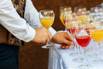 Glasses in a row at a buffet table
