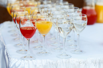 Glasses in a row at a buffet table