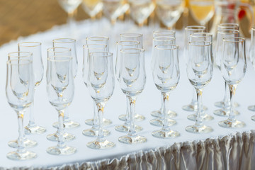Glasses in a row at a buffet table