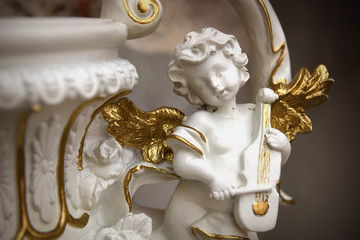 Little angel statuette with golden details