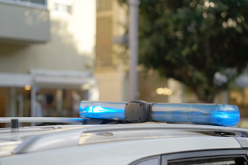 Obraz na płótnie Canvas Close-up of the blue lights on top of a police vehicle