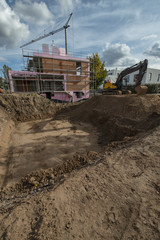 Construction site foundation with excavator
