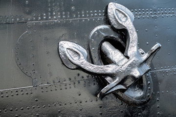 Ship heavy old metal anchor on the side of the boat. © 1tomm
