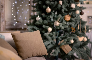 Happy new year decoration. Merry christmas decoration. Christmas interior, sofa, pillow, Christmas tree, happy new year