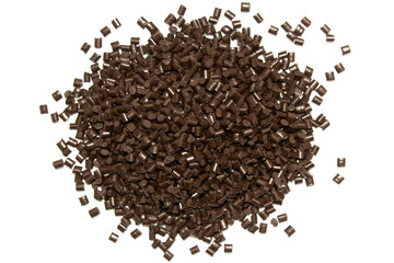 Plastic pellets. Polypropylene granules of brown on a white background. Polymeric dye.