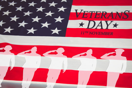 Veterans day background. Text veterans day 11 th november , the USA flag and the shadow of the soldier. Toning