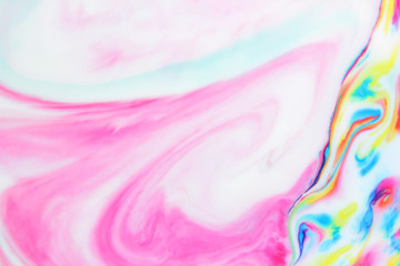 Multicolored pattern with paints in liquid, abstract background with spots of paint on white background, background for designer