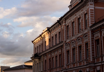 An ancient building at sunset in golden and purple tones