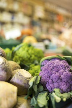 Close up of delicious and colourful vegetables with the market stall blurred in the background in England, United Kingdom
