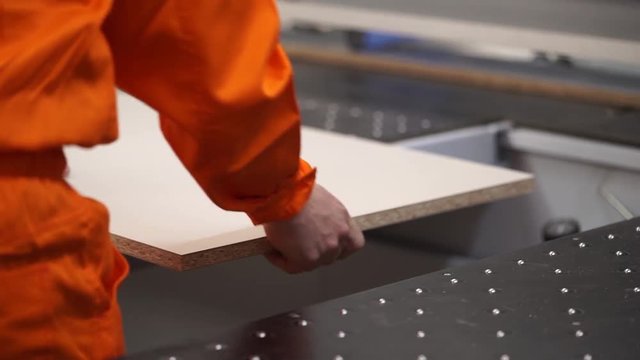 automatic chipboard cutting on furniture production. sticker