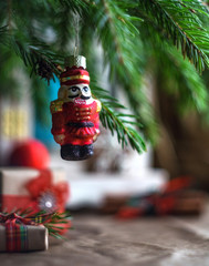 Christmas tree decoration nutcracker  on a blurred xmas background