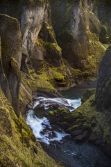 A wild and deep Fjarrglifur canyon located in the southern Iceland