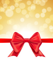 Christmas defocused bokeh background with red bow. Gift card holiday celebration invitation xmas