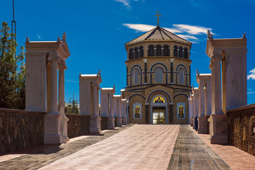 Fototapeta premium Famous orthodox monastery of Kykkos, Holy monastery of the Virgin of Kykkos in Cyprus. Way to the church near king Macarius grave. Travel sightseeing image