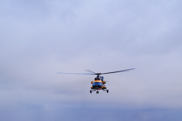 Fototapeta na wymiar The helicopter in the sky. Saint-Petersburg. Russia.