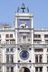 Detail of the top of the Clock Tower in Piazza San Marco, Venice, Italy with the striking bronze bell and astronomical clock