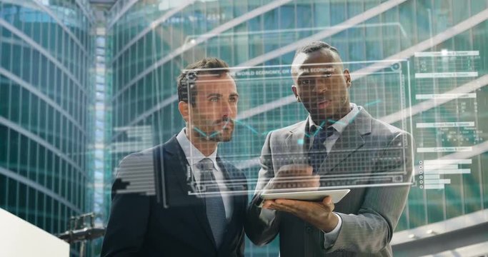  Two businessmen discuss economics and hand touches themselves to see the financial holographic trends in holography appearing in front of him. Concept of: increased reality and future 183 / 200 chara - Powered by Adobe