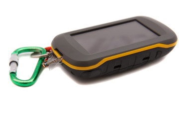 Fototapeta na wymiar Handheld GPS device with carabiner on white background