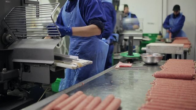 quality control in the production of sausages. smoked products shop