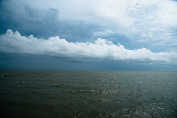 Fototapeta na wymiar Storm Clouds over Atlantic Ocean Blue and Green Landscape