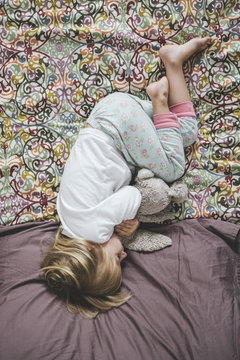 Little Girl Sleeping on Bed